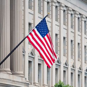 American flag on the facade of a historic building