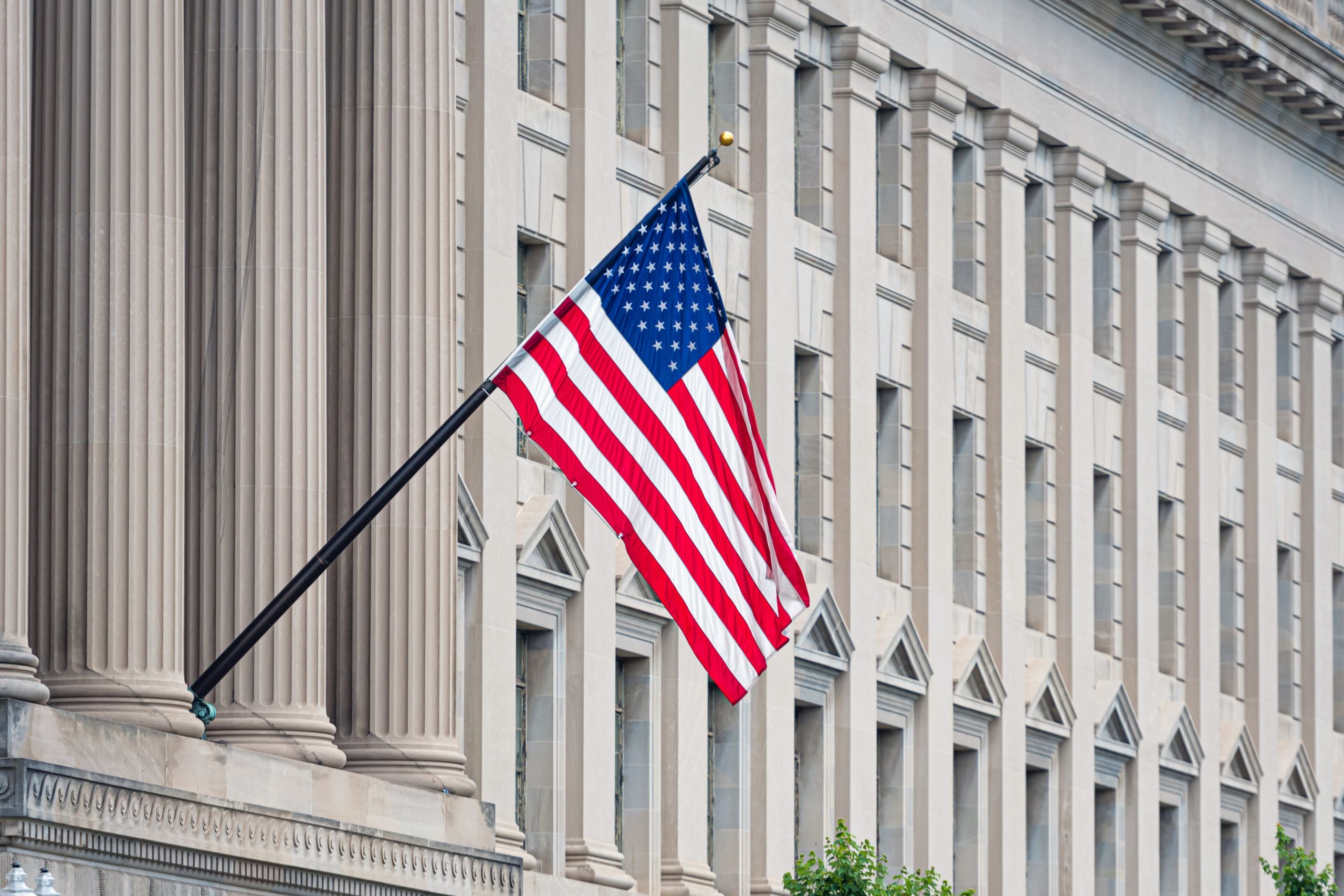 American flag on the facade of a historic building